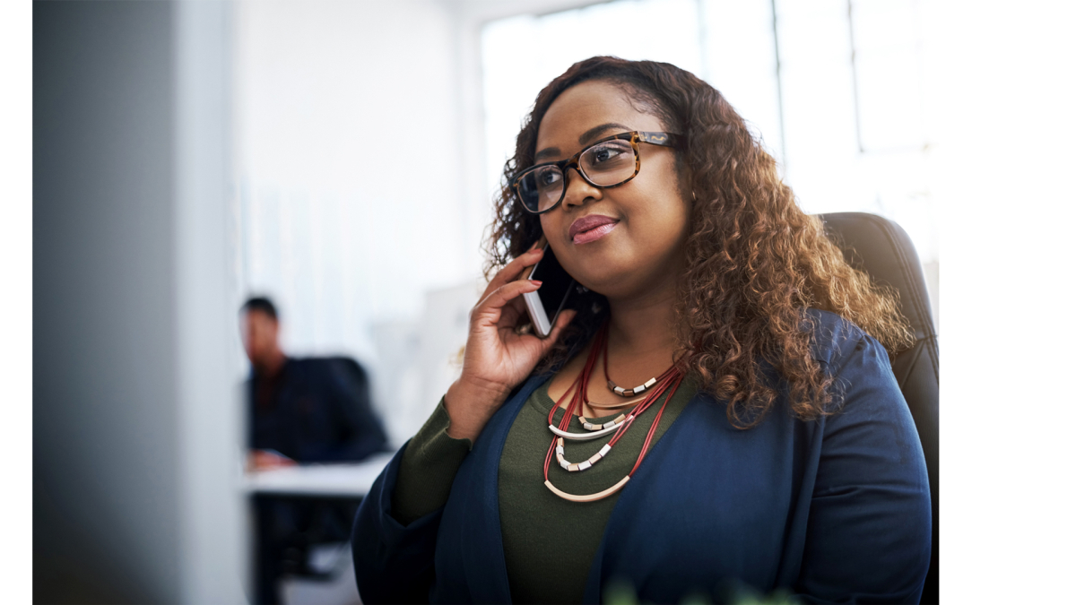 Woman talking on phone in office