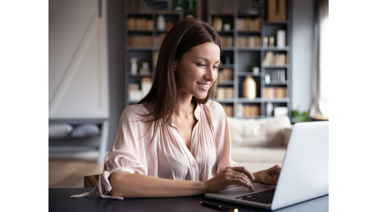 Woman working on laptop in home office